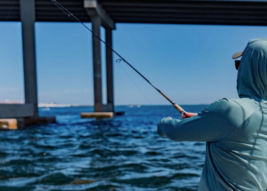 fishing on pontoon under destin bridge