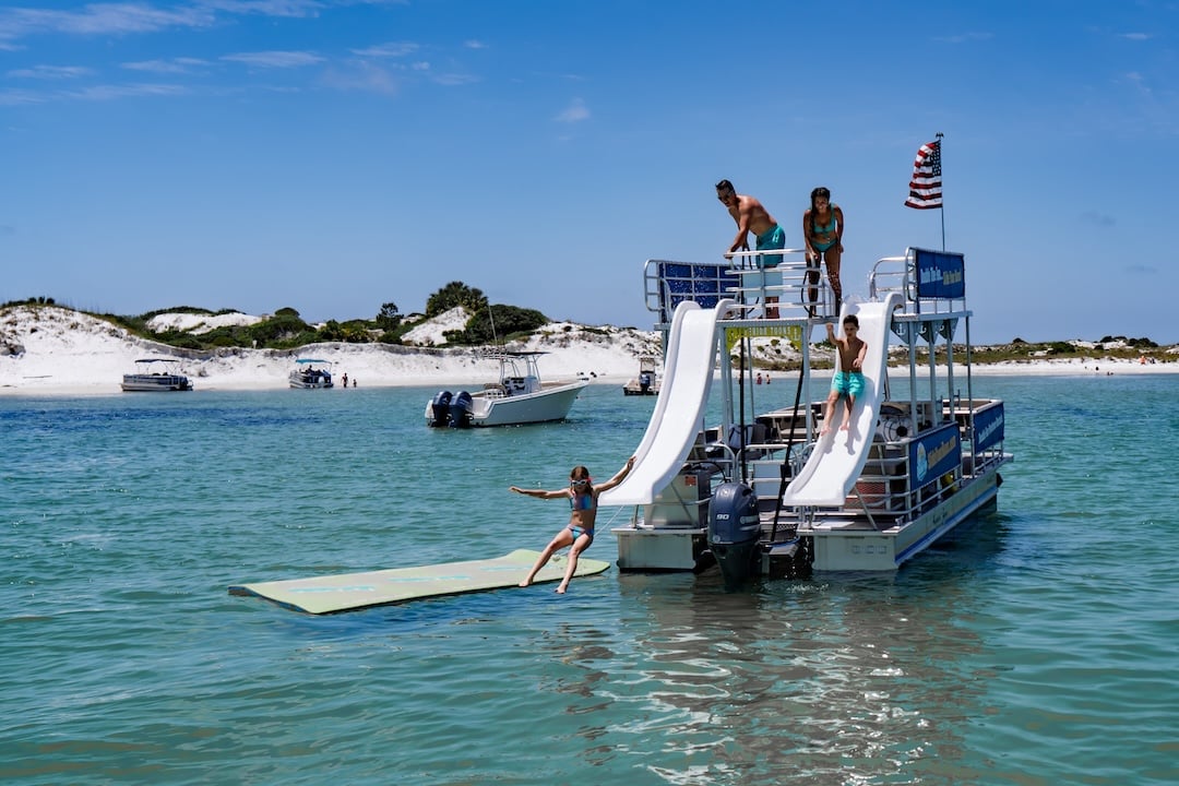 family parked at shell island on a double decker pontoon boat