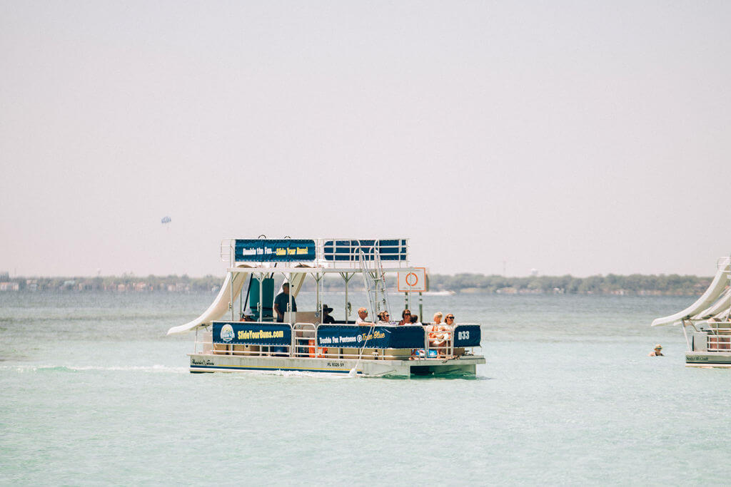 double decker pontoon boat parked in the ocean in destin, florida