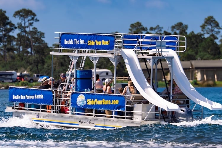 double decker pontoon boat cruising through st andrews bay in panama city beach