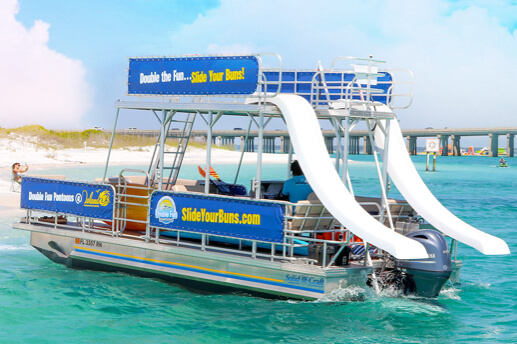 double decker pontoon boat with two slides in the ocean in panama city beach florida