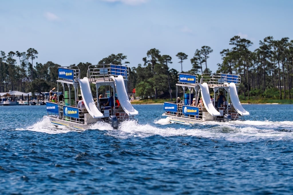 two double decker pontoon boats cruising in fort walton beach fl